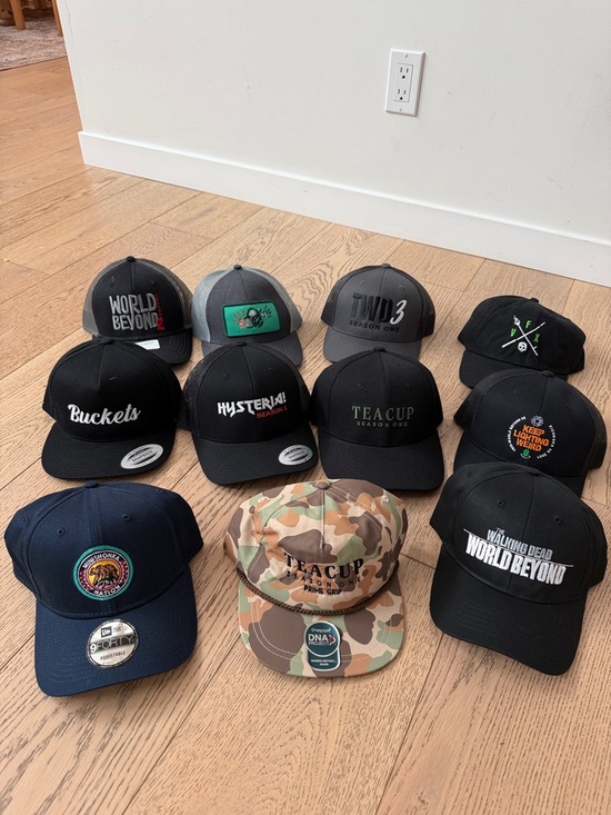 Other - 11 unworn baseball hats- embroidered with production names.